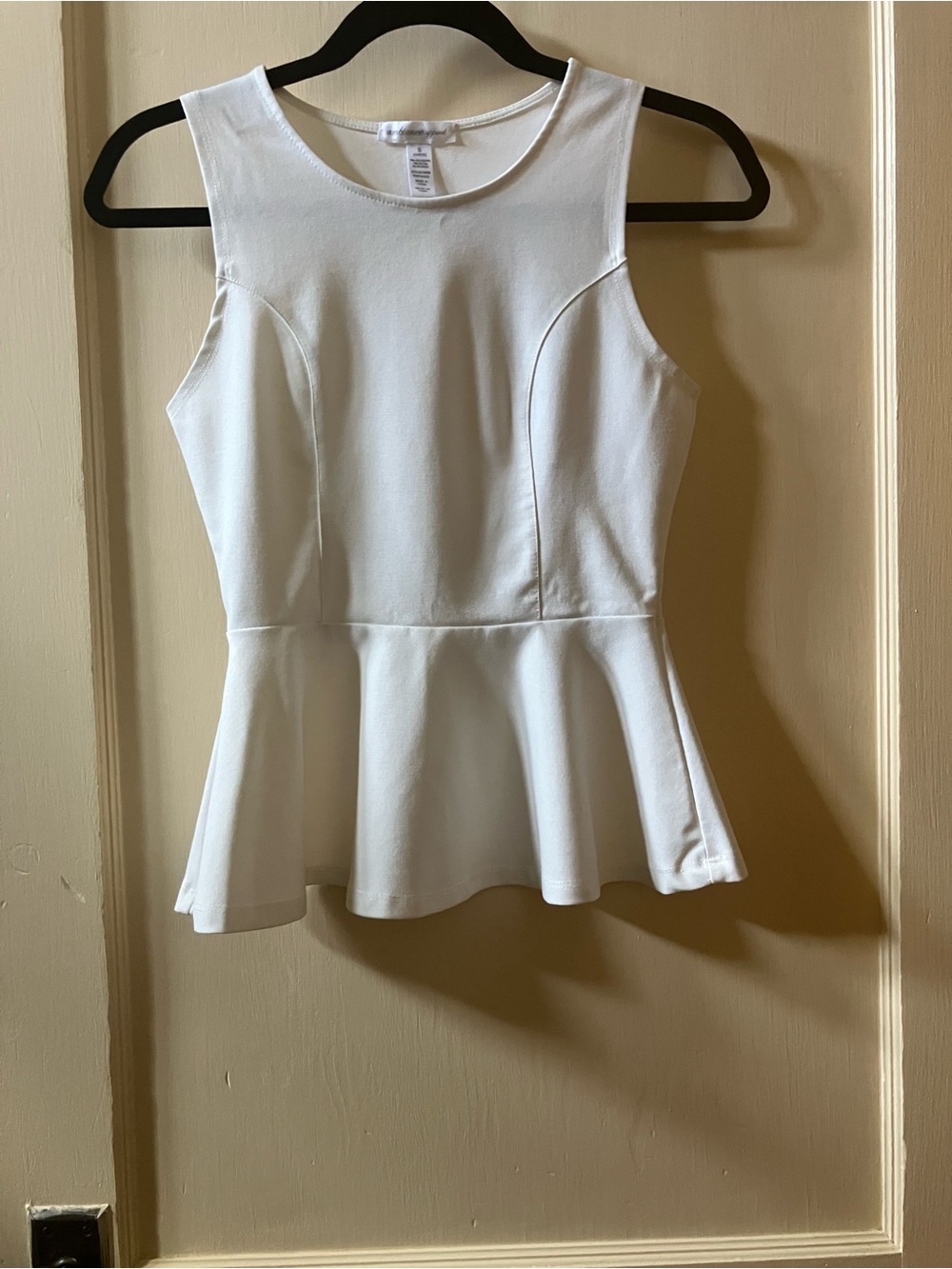 Ambiance White Sleeveless Peplum Top